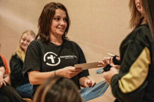 Mike Wolanin | The Republic Paige Sneed receives a certificate and gift card for graduating the Women Recovering with a Purpose (WRAP) program during a graduation ceremony in the Cal Brand Meeting Room at Columbus City Hall in Columbus, Ind., Wednesday, Nov. 30, 2022