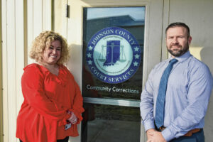 Johnson County Court Services Director/Chief Probation Officer Angela Morris, left, and Community Corrections Director Tony Povinelli pose for a photo outside the entrance to Community Corrections on Feb. 8 in Franklin. Photo credit Noah Crenshaw Daily Journal