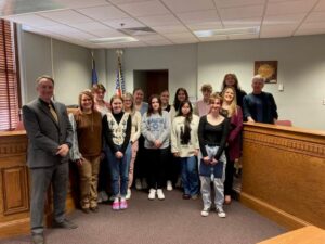 Steuben County’s Teen Court, sponsored by the state’s Juvenile Detention Alternatives Initiative, provides a jury of peers for teenagers accused of low-level misdemeanor offenses. Front row, from left: Steuben County Assistant Prosecutor David Brown and Teen Court Administrative Assistant Kelly Gonya; Fremont High School students Tressa Howey and Elyse Anzelmo. Second row, from left: Angola High School students Rylie Certa, Leila Cash and Genesis Munoz with Teen Court Judge Abbee Vetter from Sprunger & Sprunger Attorneys At Law. Third row, from left: Angola High School students Griffin Michael, Milena Antos, River Spreuer, Layla Hagerty and Angola Middle School student Dawson Hagan. Back row, from left: Angola High School student Darius Treadway and Steuben County JDAI Coordinator Kathy Armstrong. Those not in the photo include Angola High School students Mackenzee Wombacher, Kendall Stultz and Landin Stultz; Oak Farm Montessori School student Ivy Witmer and Steuben County Sheriff’s Deputy Mark Fisher who provides courthouse security.