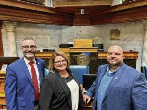 Johnson County crisis intervention deputies Jim Engemark, Shannon Chambers and Chad Poytner pose for a photo inside the Indiana Statehouse in 2023. The deputies were at the Statehouse as part of legislator meet and greet for National Alliance for Mental Illness Indiana. Submitted photo